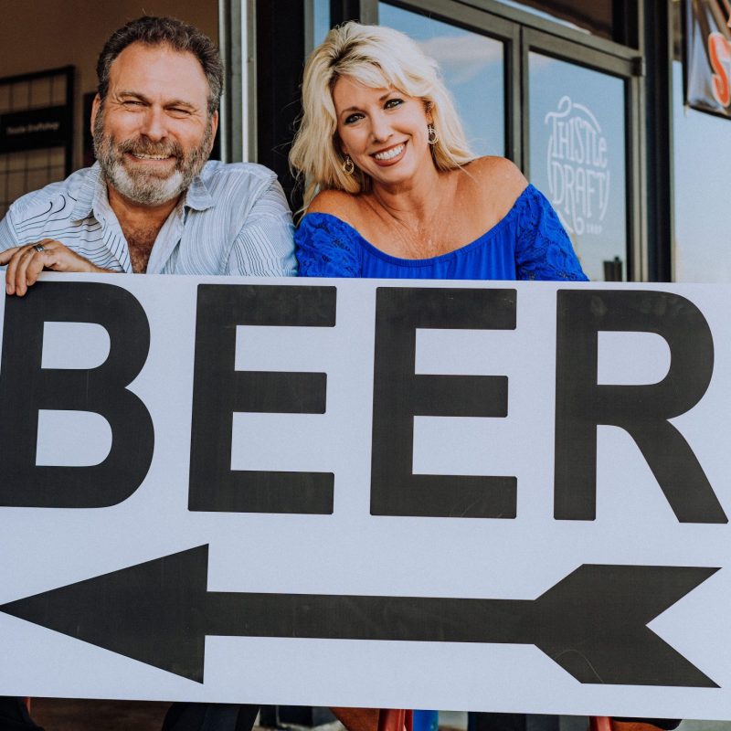 Scheri and Hugh Hait pointing the way to beer
